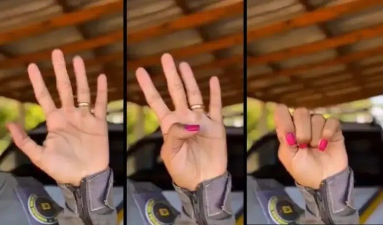 Fechou a mão assim? Ela está pedindo ajuda
